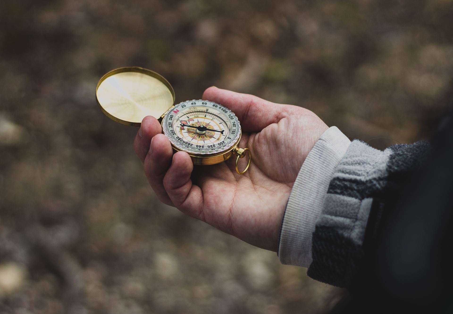 a close up of a hand holding a coin